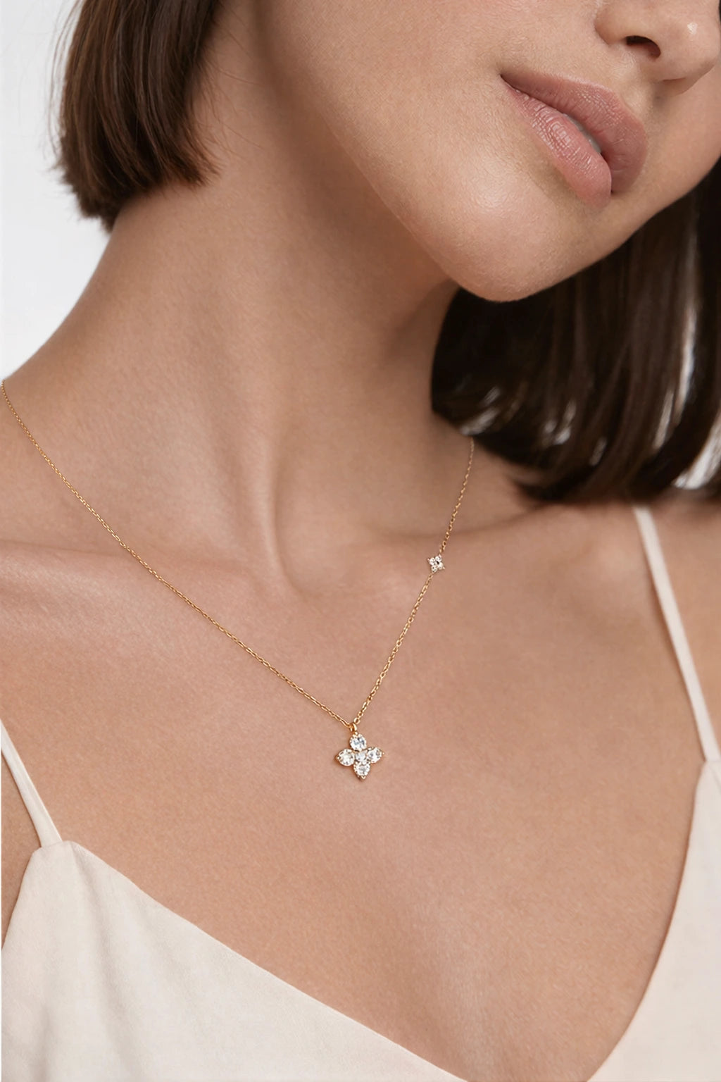Twin Four Clover Diamond Necklace in solid gold worn on model