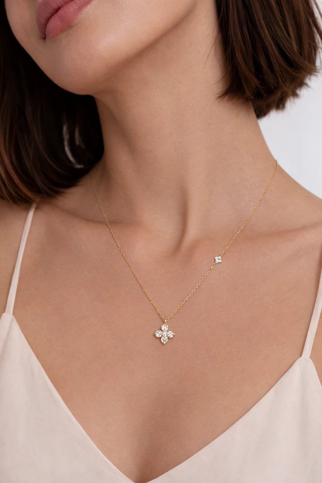 Twin Four Clover Diamond Necklace showing scale on neckline